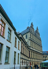 Obraz premium Historic town hall of Ghent: stunning stone facade against blue sky