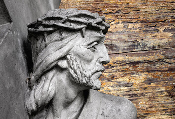 Jesus Christ under the weight of the cross. The suffering and death of God