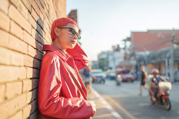 Gen z girl leather fashion with punk Asian woman tourist of local city Southeast Asia travel trendy...