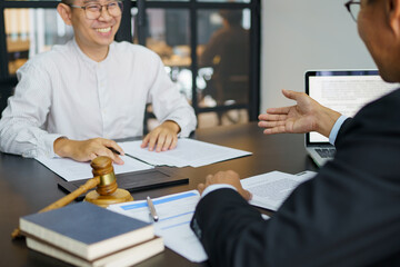 Lawyer Legal counsel presents to the client a signed contract with gavel and legal law. justice and...