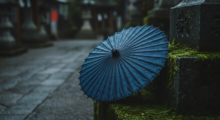 Serene blue umbrella resting on mosscovered stones ancient temple tranquil scene