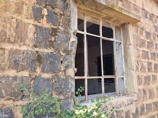 old window in stone wall