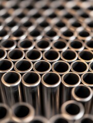 Abstract close-up of metal tubes arranged in rows, industrial background, manufacturing, engineering, precision, macro shot, metallic texture