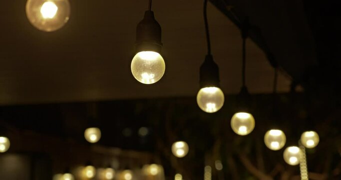 Illuminating festive evening string lights outdoor gatherings coziness nighttime atmosphere