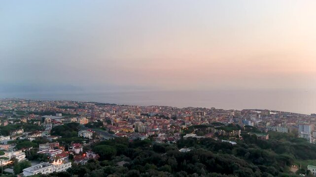Salerno city along the coast on a beautiful night with ending sunset.