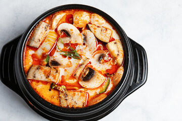 Spicy Thai soup with mushrooms in coconut milk