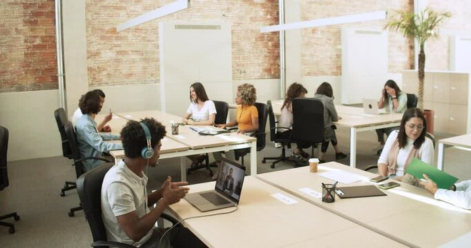 Young Creative Team Working Together in Modern Coworking Office