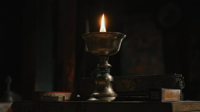 Brass Oil Lamp Burning in Buddhist Temple