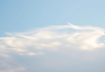 Subtle, wispy clouds drift across a pale blue sky, sky, subtle