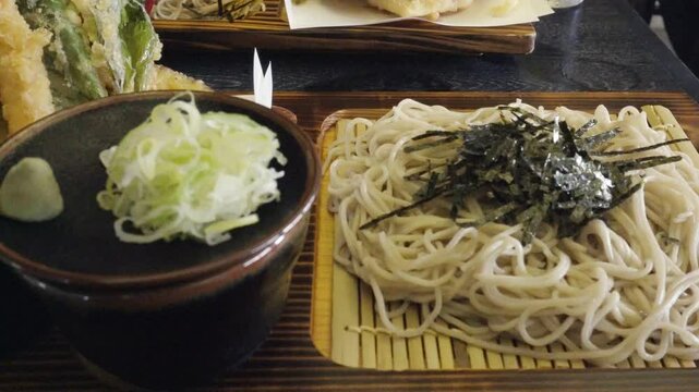 A delicious plate of traditional Japanese zaru soba, served cold with crispy tempura on the side. Japan