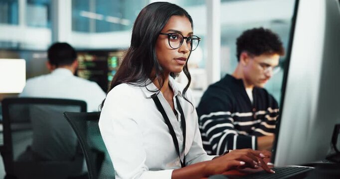 Woman, programmer and typing on computer in office for research, programming and software update. Person, online and information for web development, application and troubleshooting of system server