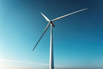 Obraz premium Tall Sleek Wind Turbine Against Clear Blue Sky in Daylight