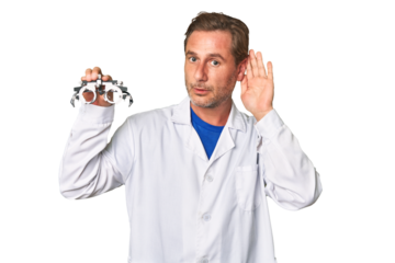 A middle-aged optometrist man trying to listening a gossip.