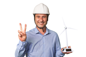 A middle-aged architect man holding a windmill model showing number two with fingers.