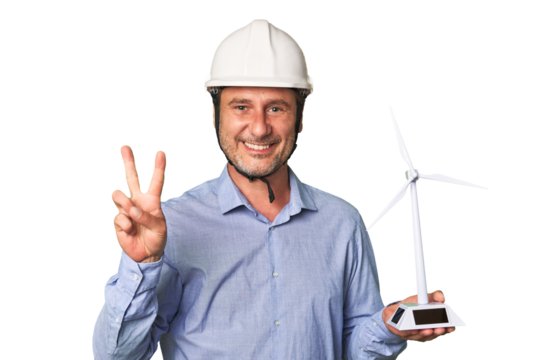 A middle-aged architect man holding a windmill model showing number two with fingers.