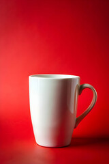 Obraz premium White mug on red background creating a contrast showcasing simple yet elegant design