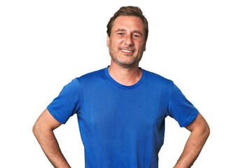 A middle-aged man isolated confident keeping hands on hips.