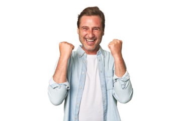 A middle-aged man isolated cheering carefree and excited. Victory concept.