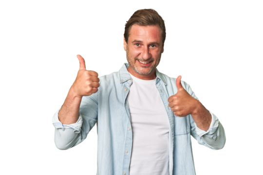 A middle-aged man isolated raising both thumbs up, smiling and confident.