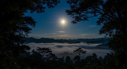 Fototapeta premium Nighttime Landscape with Moon and Fog Rolling Over Distant Mountains