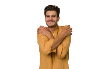 Young handsome caucasian man isolated on white background hugs, smiling carefree and happy.
