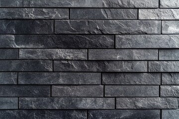Dark gray stone wall, rectangular tiles arranged in a horizontal pattern, exhibiting natural stone texture, a consistent color