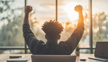 Success Businessman celebrates sunset.