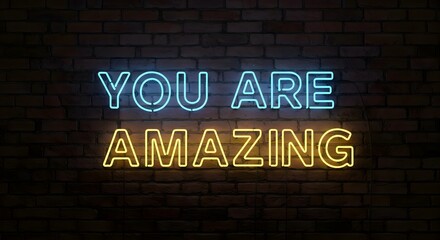 Obraz premium Neon Sign You Are Amazing Against a Brick Wall