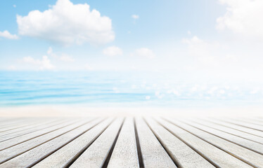 summer background of wooden embankment against defocused sea