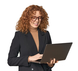 Young Caucasian redhead businesswoman with laptop happy