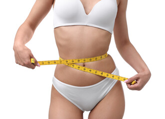 Woman with slim body and measuring tape on white background, closeup