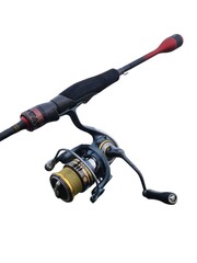 Close-up of modern spinning fishing rod and reel isolated on white background