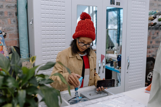 Young shop assistant making a sale