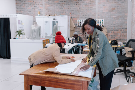Women in the workplace sewing garments