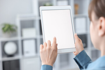 Woman with modern tablet indoors, closeup view
