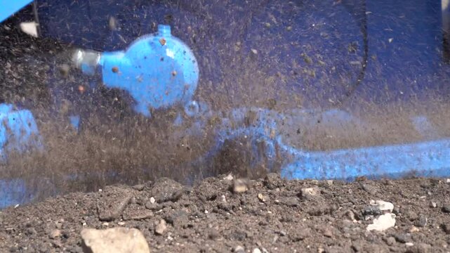 Vibratory plate compactor slow motion construction works to prepare the ground close up