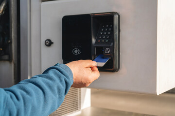 Man customer paying for fuel at modern gas fuel station