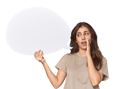 Middle Eastern woman holding comic bubble is saying a secret hot braking news and looking aside