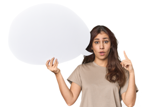 Middle Eastern woman holding comic bubble having an idea, inspiration concept.