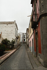 Narrow Pathway Surrounded by Colorful Houses