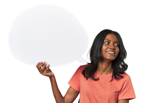 Indian woman with dialogue bubble looks aside smiling, cheerful and pleasant.