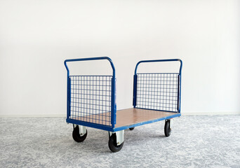Empty crate on wheels in a storage room