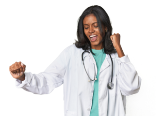 Young Indian doctor with stethoscope dancing and having fun.