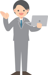 パソコンを片手に説明するビジネスマン