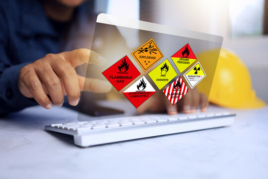 Dangerous substance concept with freight forwarders staff working to classify dangerous goods and flammable materials for proper handling