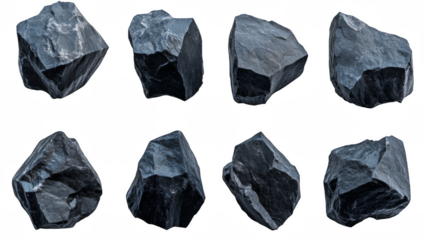 A collection of black rocks are scattered across a white background
