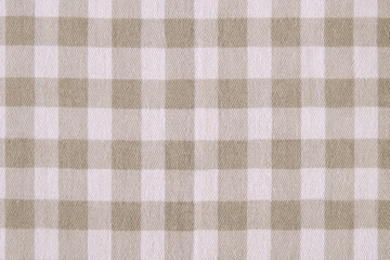 natural cotton or linen fabric in white and brown checks close-up