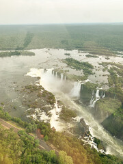 Aerial view of Iguazu Falls surrounded by lush rainforest,