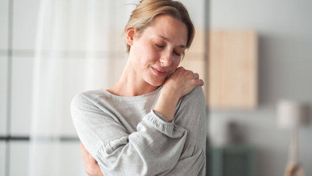 Hugging oneself happy and positive