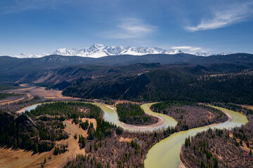 Aerial photo landscape winding river Chui meanders in mountains, forest trees with sunlight, Altai...